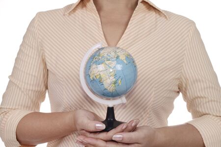 An Asian woman holding a small globe.の写真素材