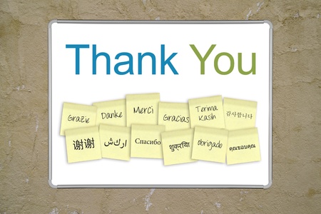 A whiteboard with the words &quot,thank you&quot, in 13 different languages. の写真素材