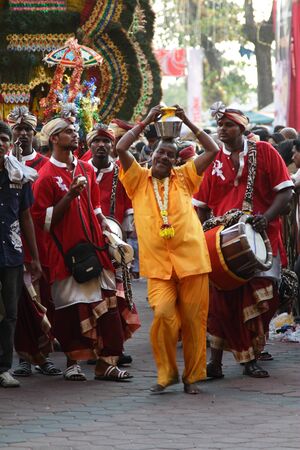 BATU CAVES, MALAYSIA - JANUARY 20:A Kavadi procession during the Hindu festival of Thaipusam on January 20, 2011 in Batu Caves, Malaysia.のeditorial素材