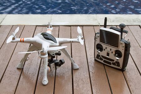 A quadcopter with camera gimbal system and radio transmitterの写真素材