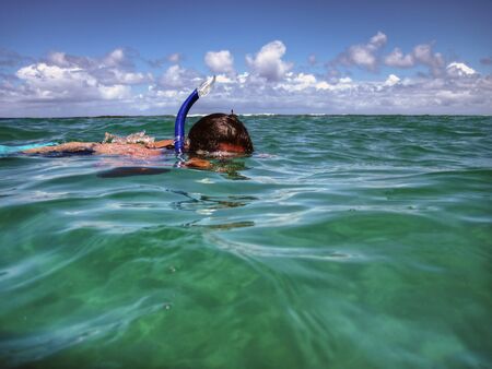 Snorkeler at Tunnels Beach in Kauai, Hawaii