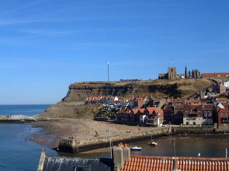 A general view of Whitby Abbey and Harbour viewed from the north side of Whitby Harbour in North Yorkshire, in England in the U.K.の写真素材