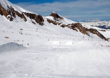 Skiers in Swiss Alps mountain snow, winter scene.の写真素材