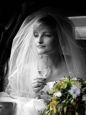 Portrait of beautiful bride in traditional wedding dress and veil.の写真素材
