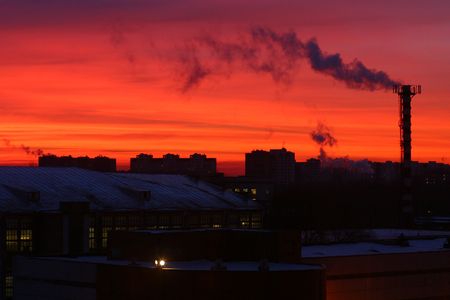 Night scene of a factory chimney polluting the atmosphere with smoke.の写真素材