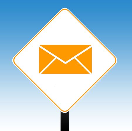 Contact email or letter road sign with directional arrow, blue sky background.の写真素材