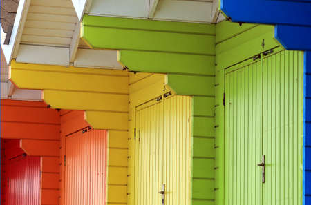 Row of colorful beach chalets or huts, abstract background.の写真素材