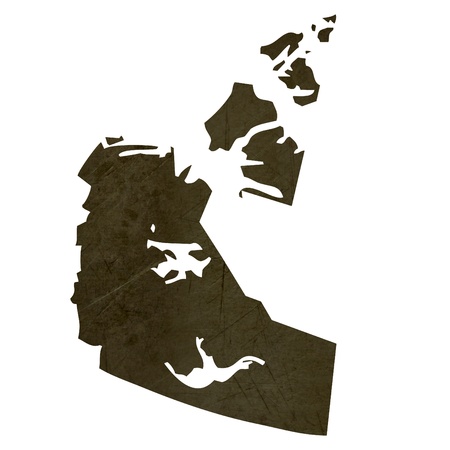 Dark silhouetted and textured map of Northwest Territories province of Canada isolated on white background.の写真素材