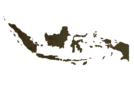 Dark silhouetted and textured map of Indonesia isolated on white background.の写真素材