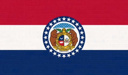 Missouri state flag of America on brick wall, isolated on white background.の写真素材