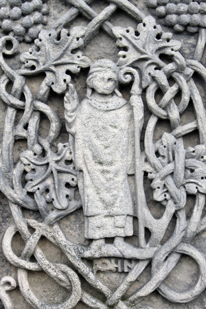 Historical religious engravings dating from the Medieval ages on a memorial.の写真素材