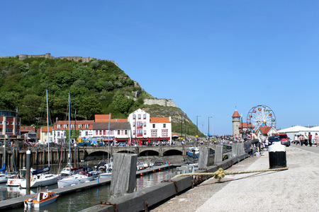 SCARBOROUGH, NORTH YORKSHIRE, ENGLAND - 19th May 2014: Scarborough town and harbor seaside resort on the 19th of May 2014. This is a popular tourist destination every summer, particularly from visitors from European countries.のeditorial素材