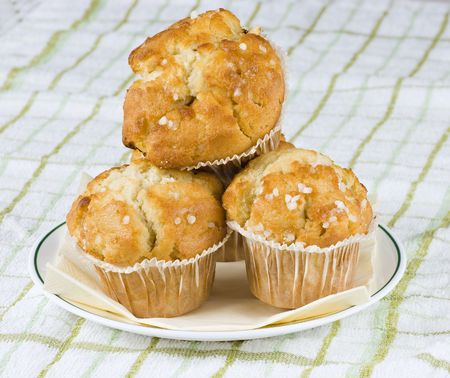 A small plate with three tasty muffinsの写真素材