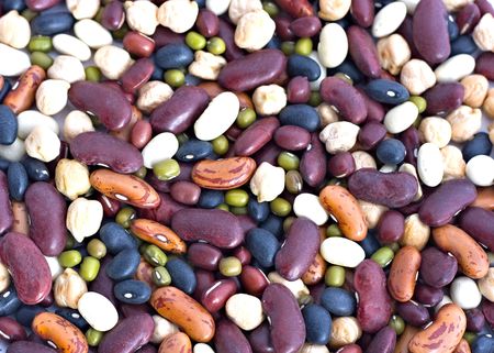 An abstract background of mixed dried beans and pulses