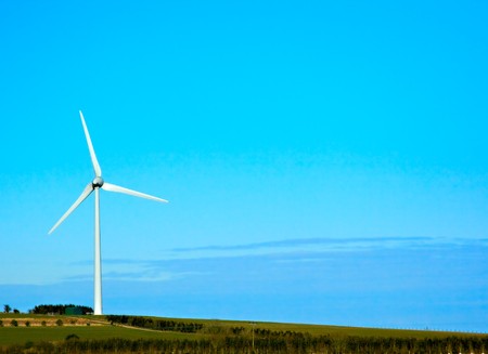 A single wind turbine stood on a hillの写真素材