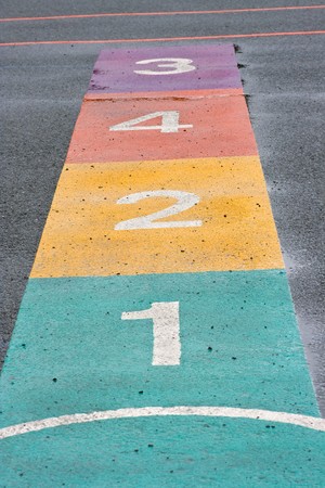 A colourful hopscotch game painted on a playgroundの写真素材