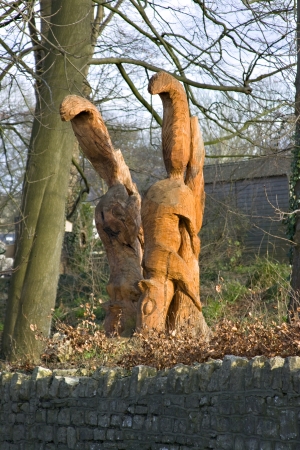 Old tree stump carved into two squirrelsの写真素材
