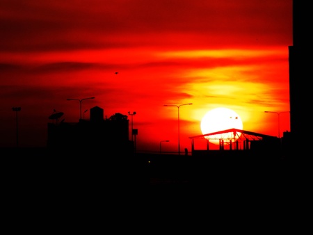 a sun drop between two towerの写真素材