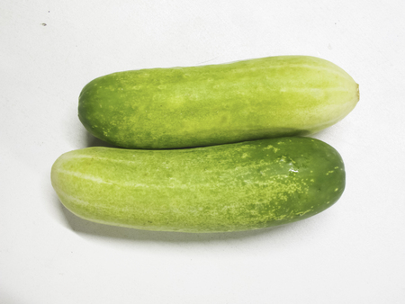 two cucumbers on white backgroundの写真素材