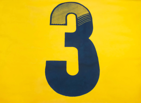 Number three on the yellow background の写真素材