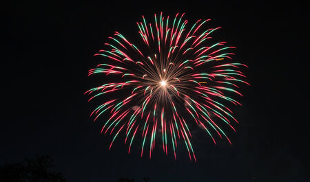 Many fireworks are mix on the skyの写真素材