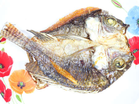 fried fish was sliced, crispy on the dishの写真素材
