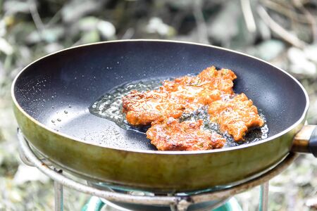 fried fish patty in the pan .の写真素材