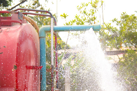Municipal water with spray on the tree.の写真素材
