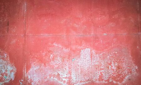 white stain on the red concrete wall textureの写真素材