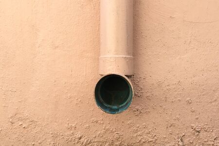 sewer pipe on concrete wall