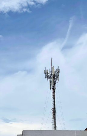 radio reflector tower with a radio antenna on top of it.