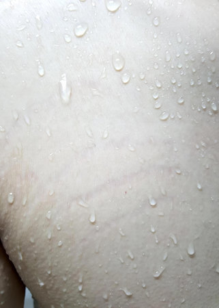 a photography of a man with a lot of water on his back, man with a lot of water on his back.の写真素材