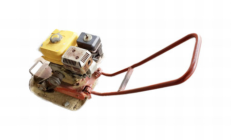 a photography of a small machine with a handle attached to it, mousetrap with a yellow box attached to it.の写真素材