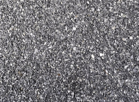 a photography of a black and white photo of a gravel surface, syringe of a black and white...