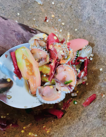 a photography of a spoon with food on it and a spoon with a spoon in it, homarus americanus shrimp and shrimp salad with a spoon.の写真素材