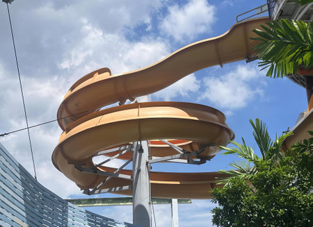 a photography of a water slide going down a tall building.