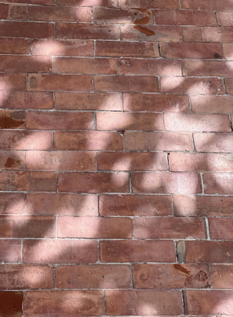 the sun shines on a brick wall..