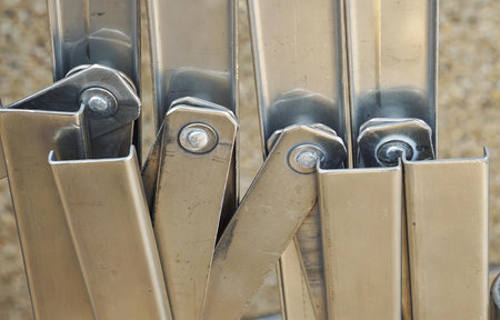 a bunch of metal handles sticking out of a container...