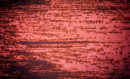 the texture of the red paint on the wall of a building.の写真素材