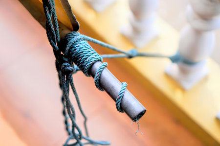 a string of rope tied to a hook.