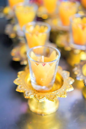 candles on a table with flowers.の写真素材