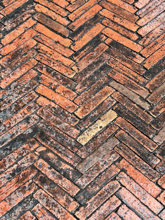 a brick wall with a pattern of red and white bricks.の写真素材