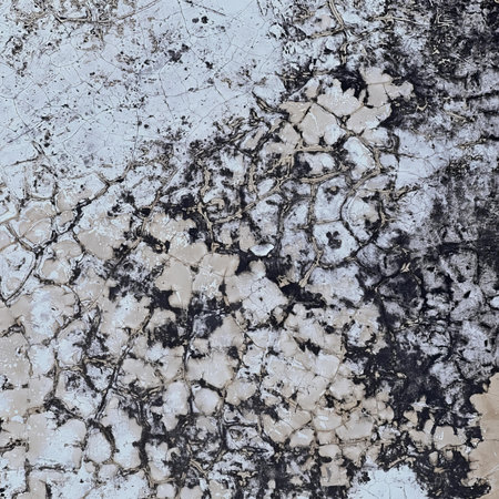 texture of a concrete wall with peeling paint.