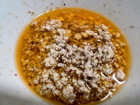 a photography of a bowl of food with a mixture of meat.の写真素材