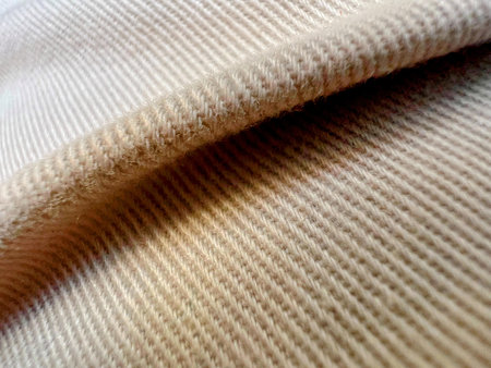 a photography of a close up of a white sweater with a black stripe.