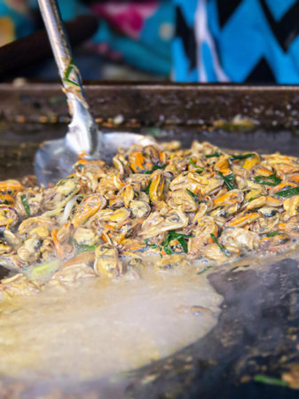 a photography of a pan of food being cooked on a grill.の写真素材
