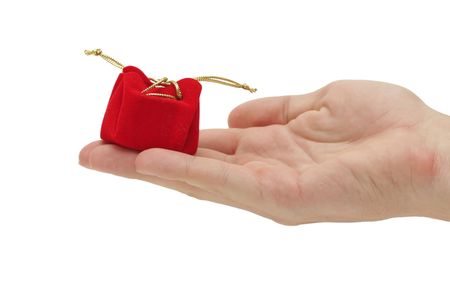 Hand holding a gift isolated on whiteの写真素材