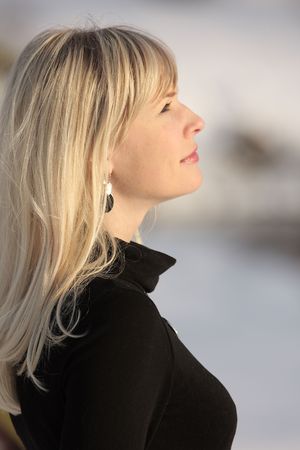 Portrait of a young beautiful woman looking upの写真素材