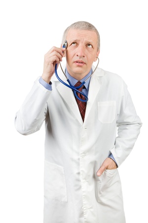 Funny mature doctor holding stethoscope on his headの写真素材