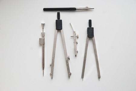drawing engineering tools on a white surface.の写真素材